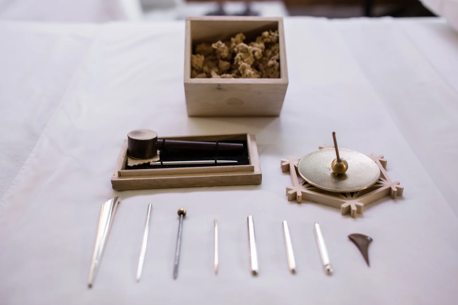 Metal treatment tools, a box of moxa wool and an incense holder.