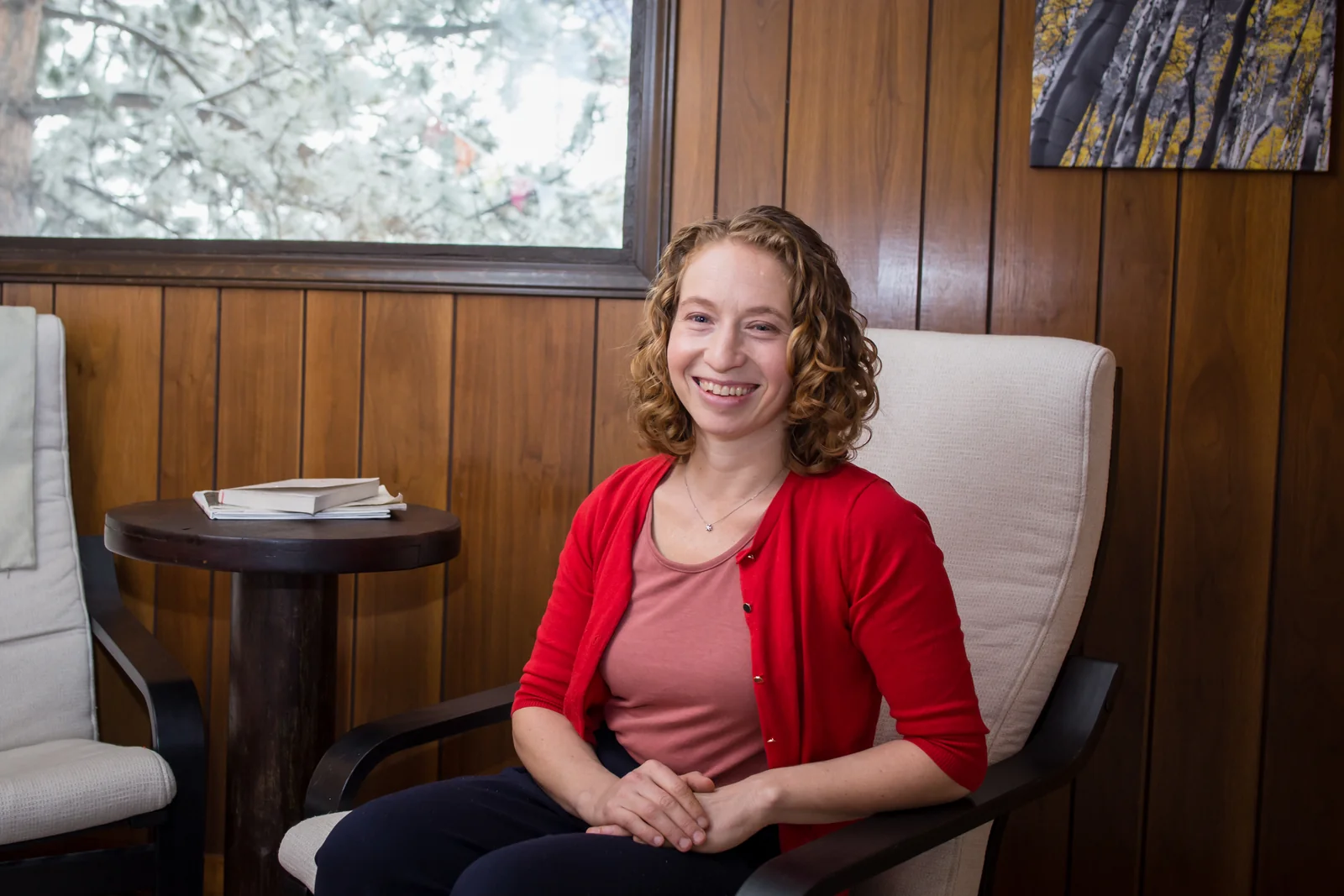 Maya Suzuki seated in a consultation chair at Bumblebee AcuTherapy.